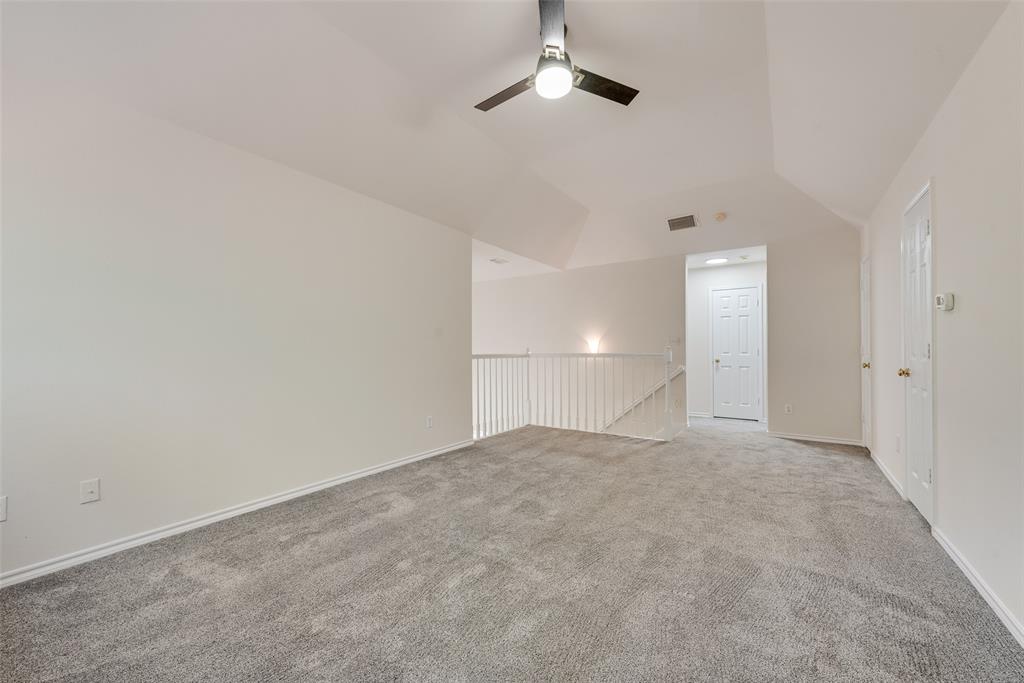 421 Roland Drive Keller, TX 76248 - Photo 19 of 40 a view of an empty room with a ceiling fan