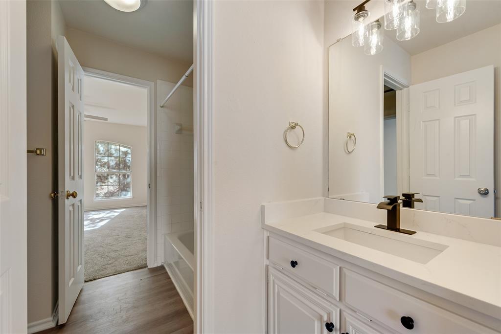 421 Roland Drive Keller, TX 76248 - Photo 22 of 40 a bathroom with a sink a shower and a mirror