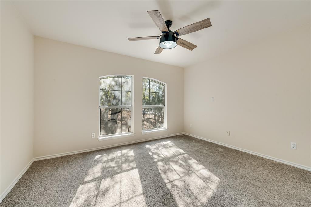 421 Roland Drive Keller, TX 76248 - Photo 24 of 40 an empty room with windows and fan