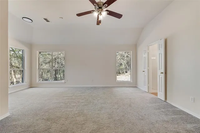 a bathroom with a bath tub with a shower