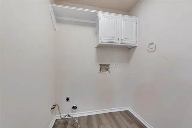 a bathroom with a sink a toilet a mirror and shower