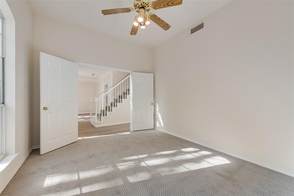 421 Roland Drive Keller, TX 76248 - Photo 7 of 40 a view of an empty room with a ceiling fan