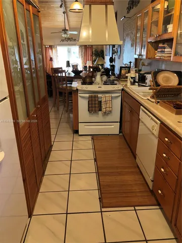 a kitchen with stainless steel appliances granite countertop lots of counter top space and cabinets