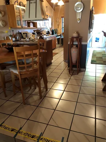 a kitchen with a sink a stove and a cabinets
