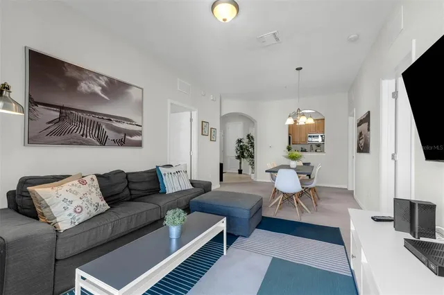 a view of a chairs and table in the balcony