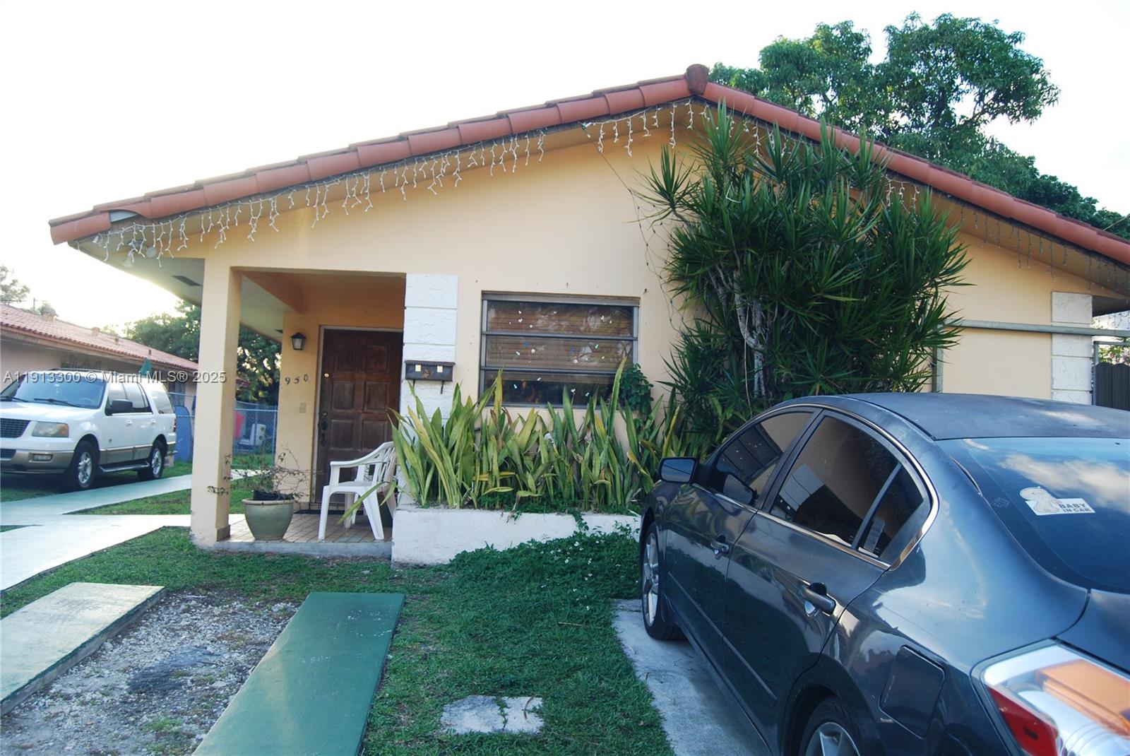 950 Southwest 13th Court Miami, FL 33135 - Photo 1 of 10 a view of a house with backyard and sitting area