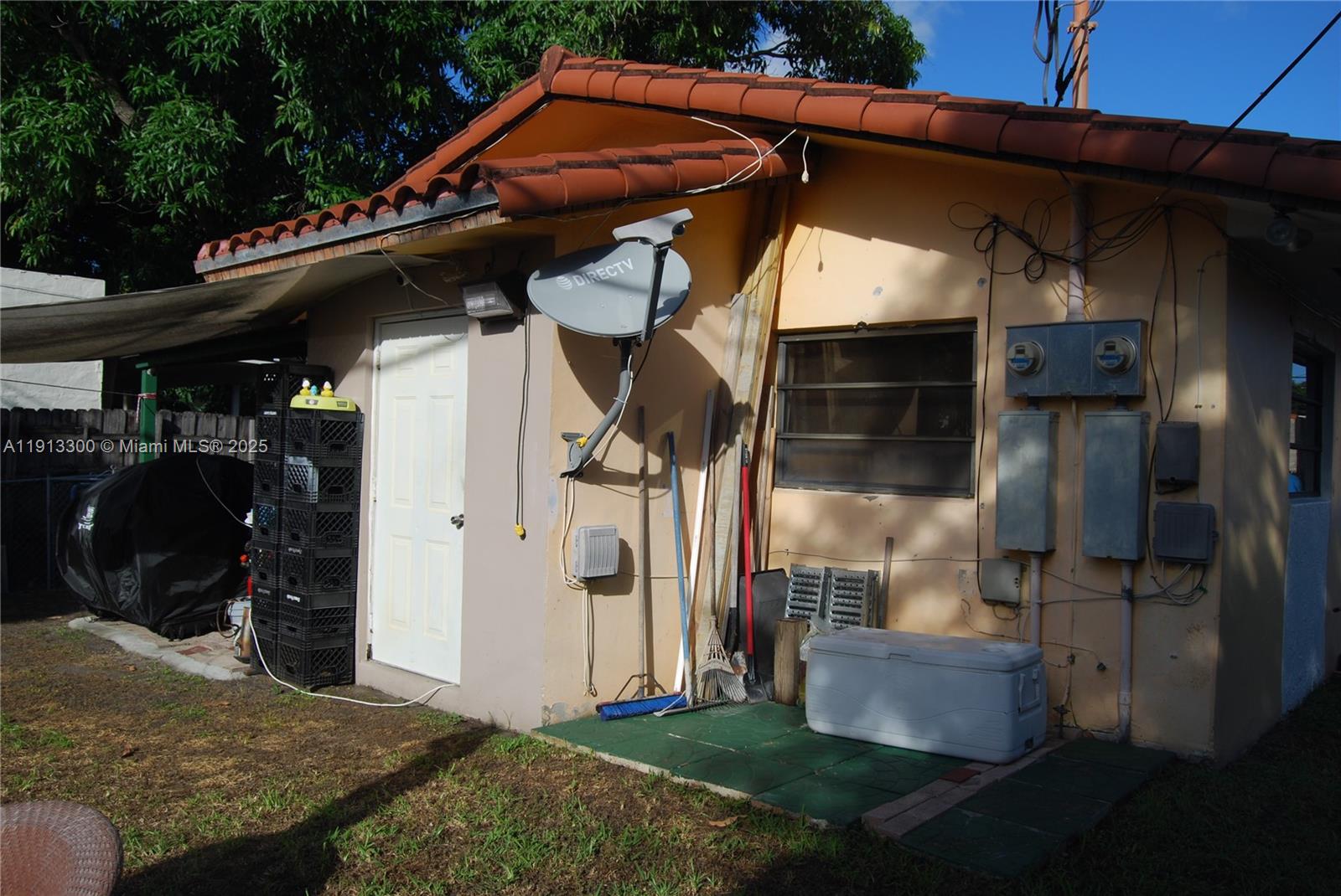 950 Southwest 13th Court Miami, FL 33135 - Photo 3 of 10 a backyard of a house with barbeque oven and outdoor seating