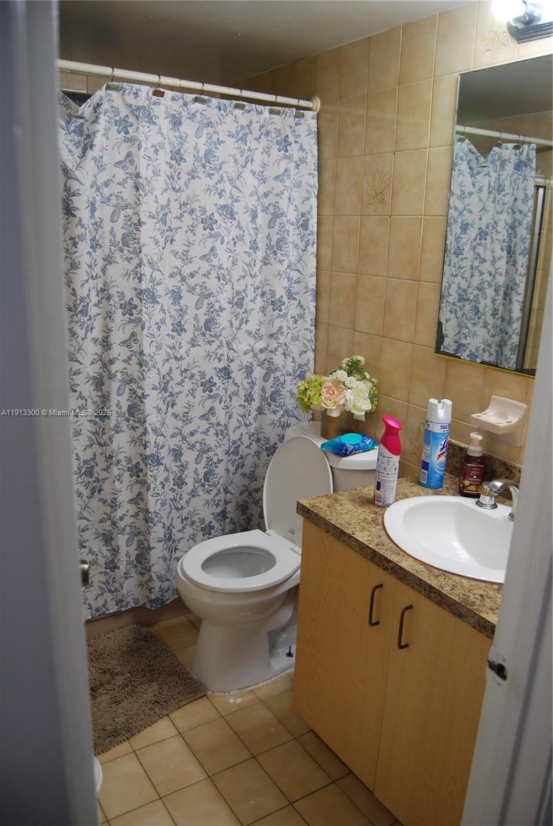 950 Southwest 13th Court Miami, FL 33135 - Photo 8 of 10 a bathroom with a toilet sink and mirror