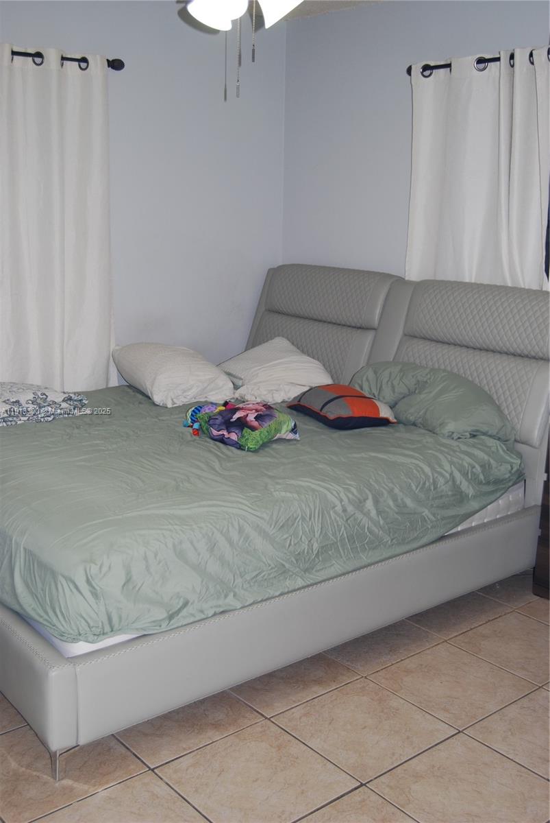 950 Southwest 13th Court Miami, FL 33135 - Photo 10 of 10 a bathroom with a granite countertop tub and white cabinets