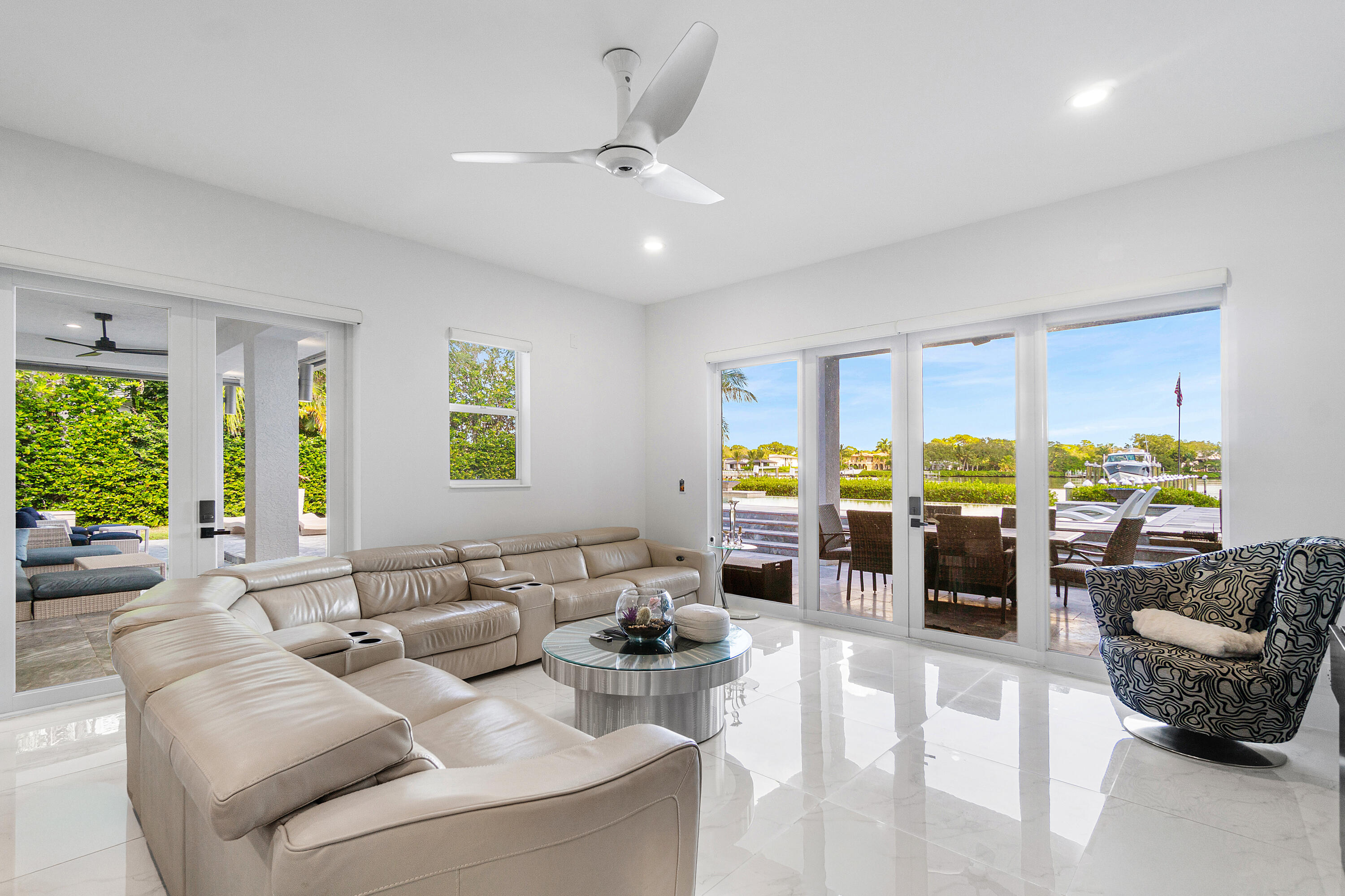 5447 Center Street Jupiter, FL 33458 - Photo 16 of 60 a living room with furniture and a large window