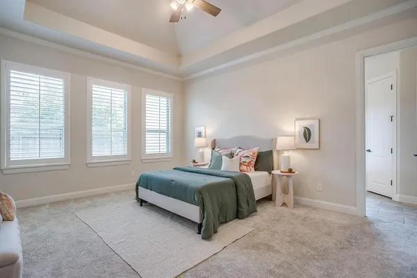 a bedroom with bed and a window