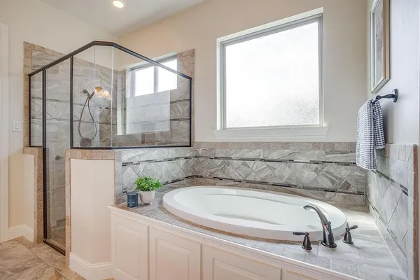 a bathroom with a bathtub and a sink
