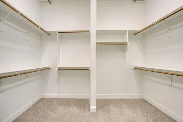 a view of an empty walk in closet