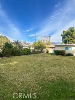 a view of a lake with a yard