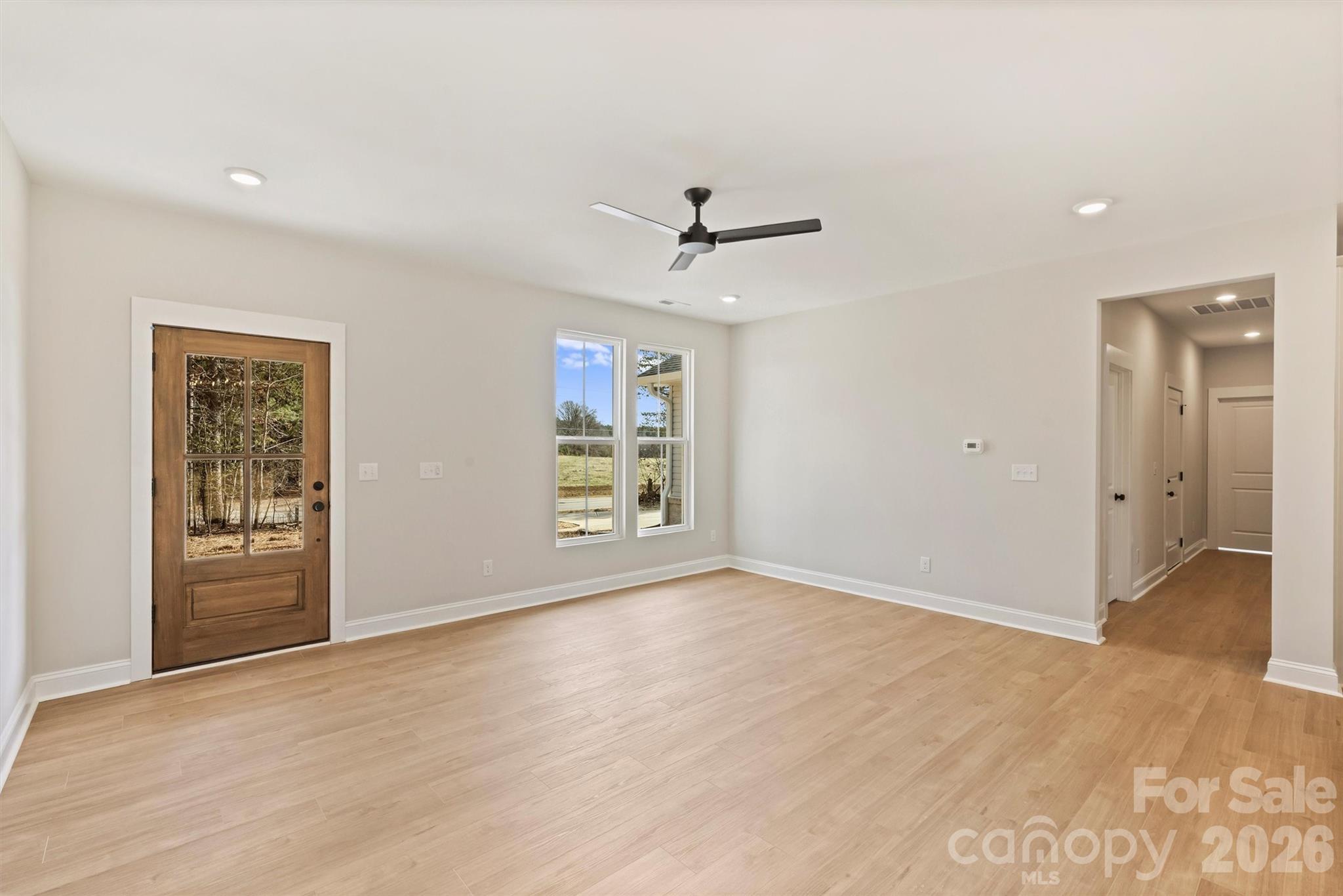 2279 Lee Lawing Road Lincolnton, NC 28092 - Photo 7 of 41 wooden floor in an empty room with a window