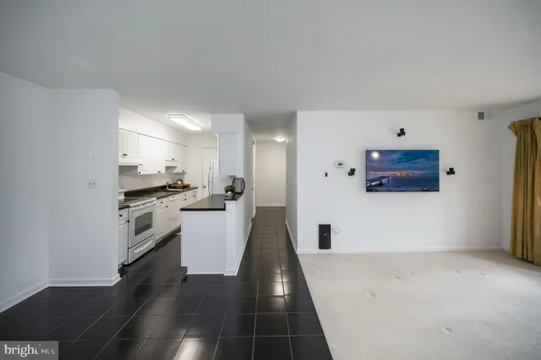 a kitchen with a stove a sink and a refrigerator