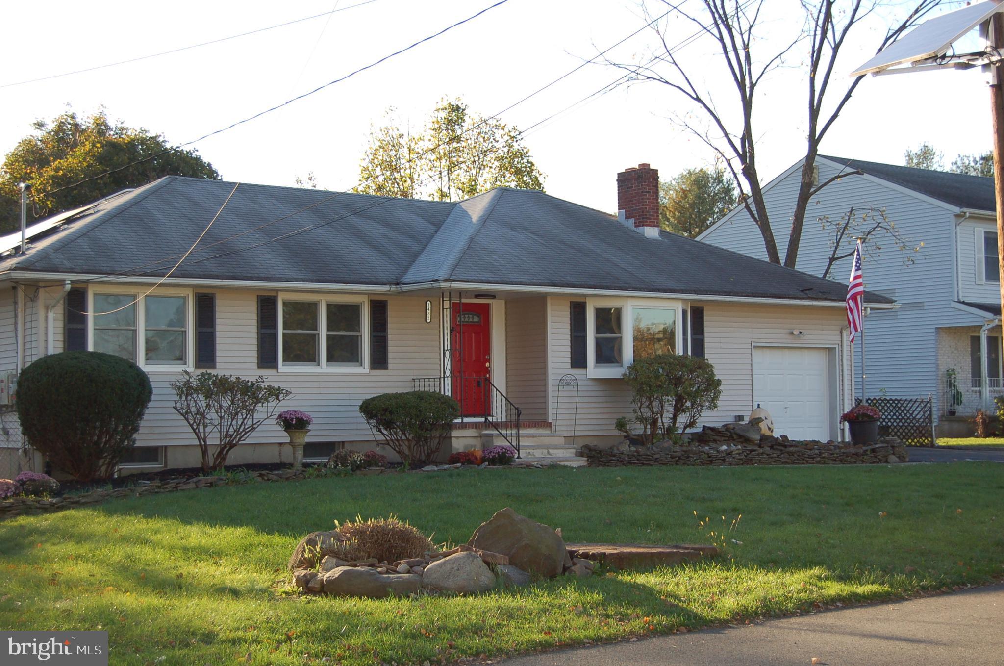 1482 Huron Road North Brunswick, NJ 08902 - Photo 2 of 17 a front view of house with yard and outdoor seating