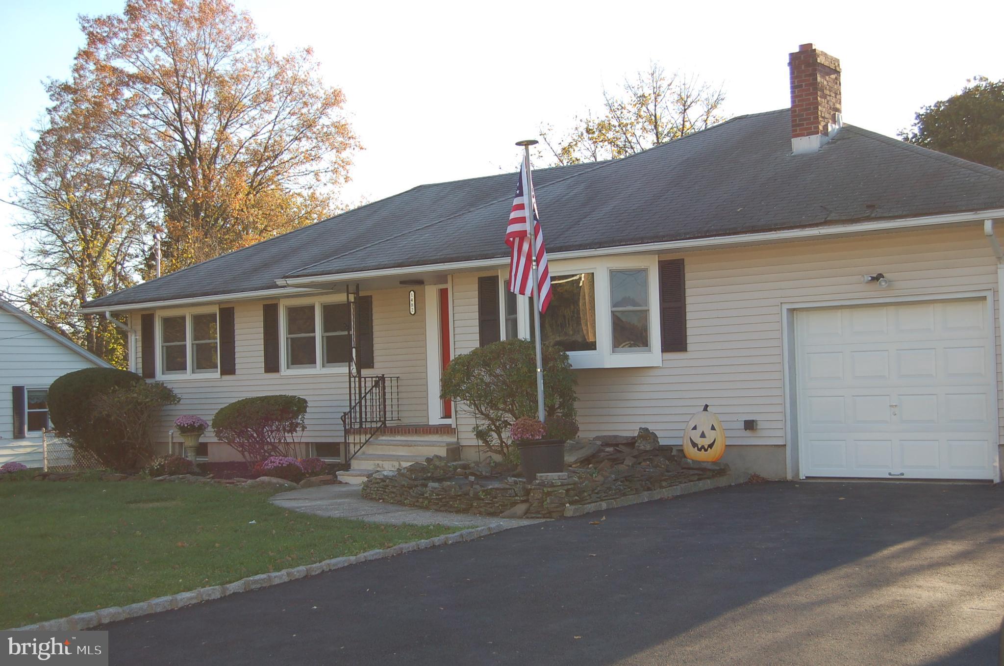 1482 Huron Road North Brunswick, NJ 08902 - Photo 4 of 17 a front view of a house with a yard