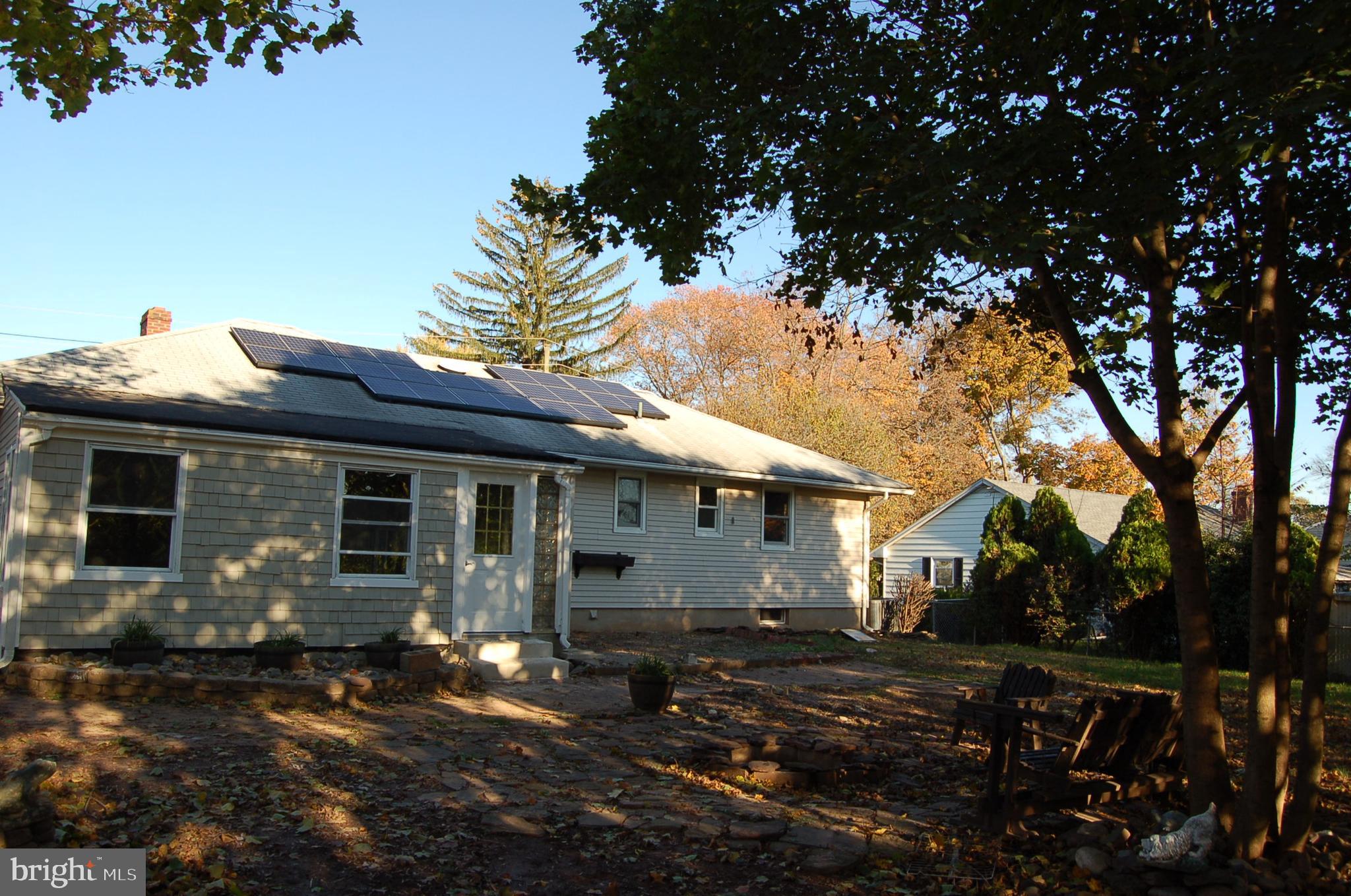 1482 Huron Road North Brunswick, NJ 08902 - Photo 5 of 17 a view of a house with yard and tree s