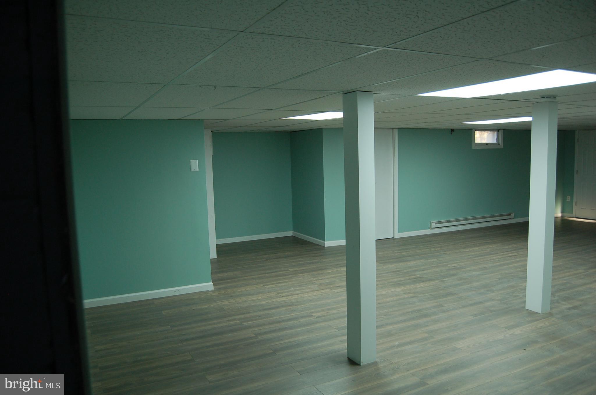 1482 Huron Road North Brunswick, NJ 08902 - Photo 10 of 17 an empty room with wooden floor