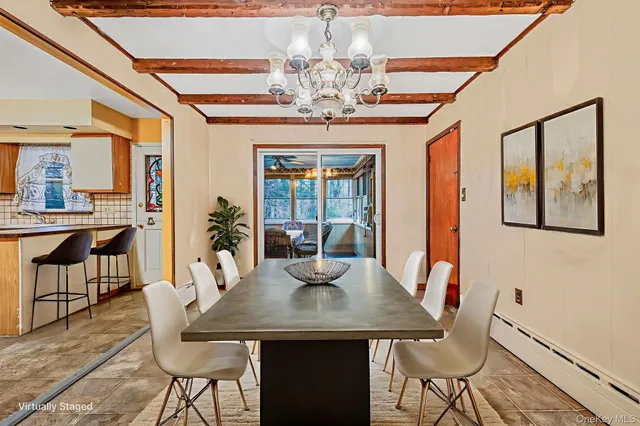 a view of a dining room with furniture window and outside view