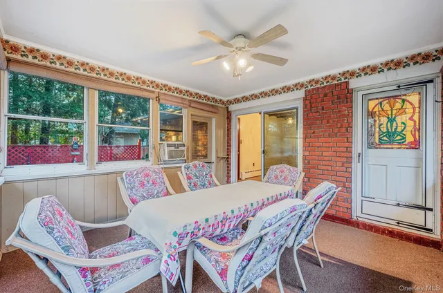 a view of a dining room with furniture window and outside view
