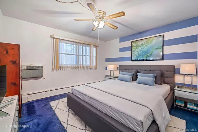 a bedroom with bed and window