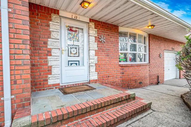 a front view of a house with a outdoor space