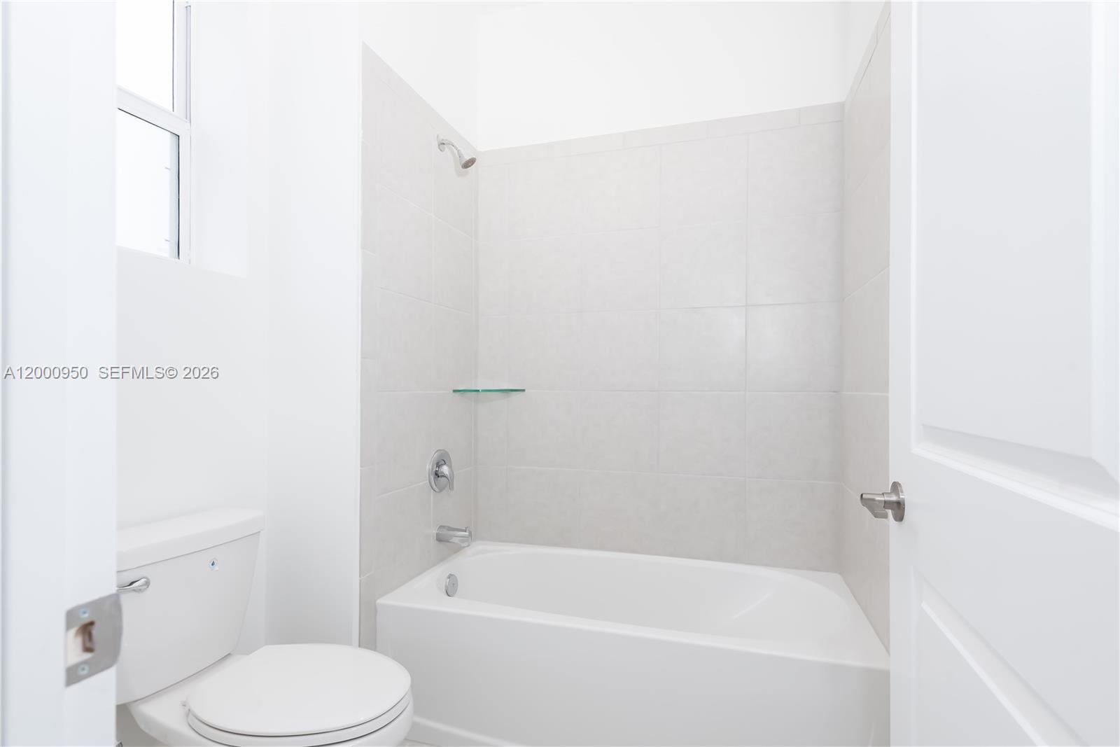 2636 Southeast 8th Court Homestead, FL 33035 - Photo 17 of 34 a white bath tub sitting next to a white toilet