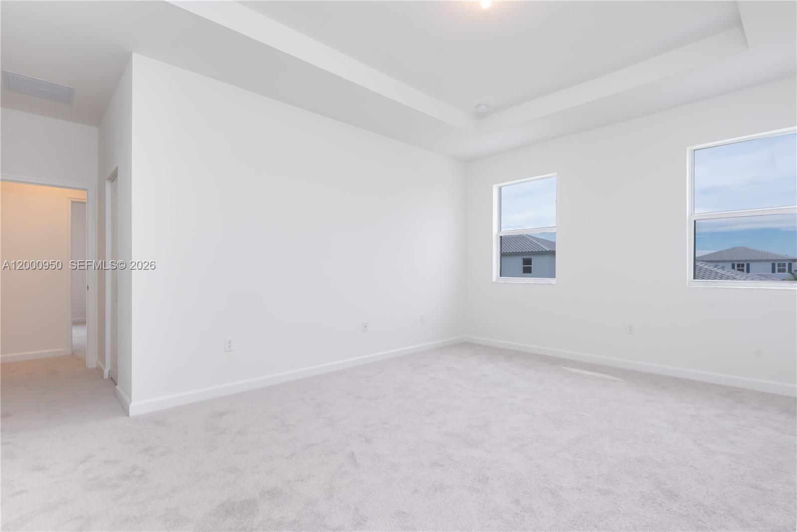 2636 Southeast 8th Court Homestead, FL 33035 - Photo 21 of 34 an empty room with a empty space and windows