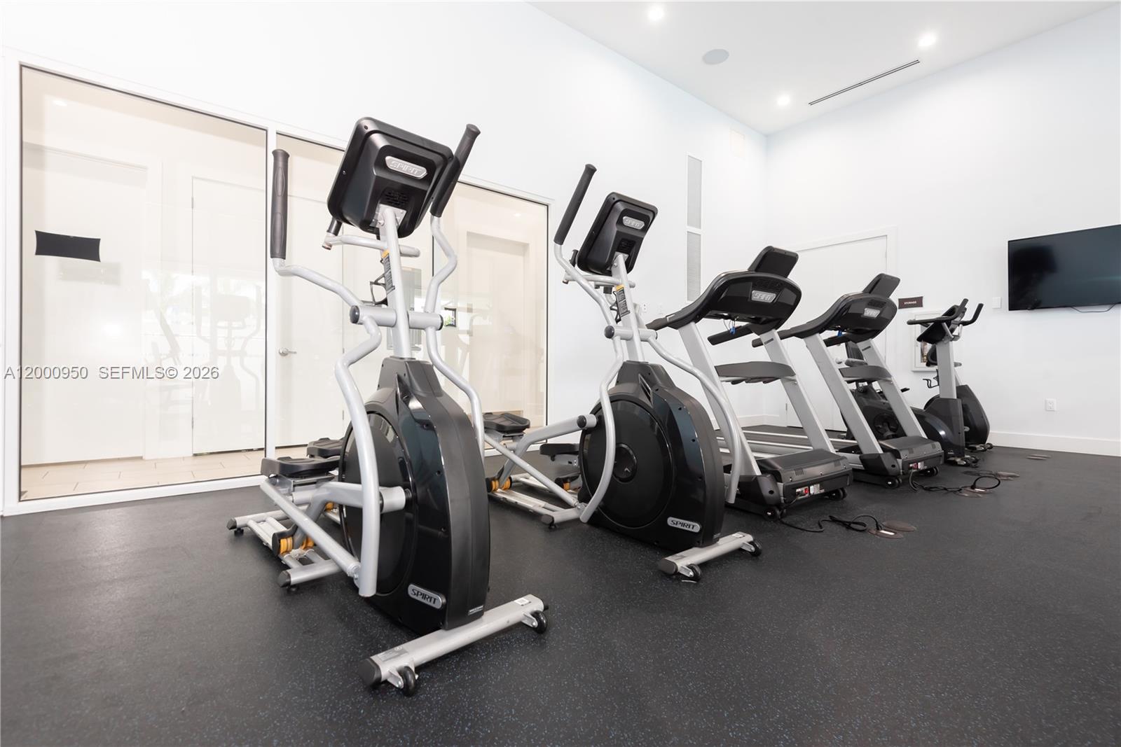 2636 Southeast 8th Court Homestead, FL 33035 - Photo 34 of 34 a view of a room with gym equipment