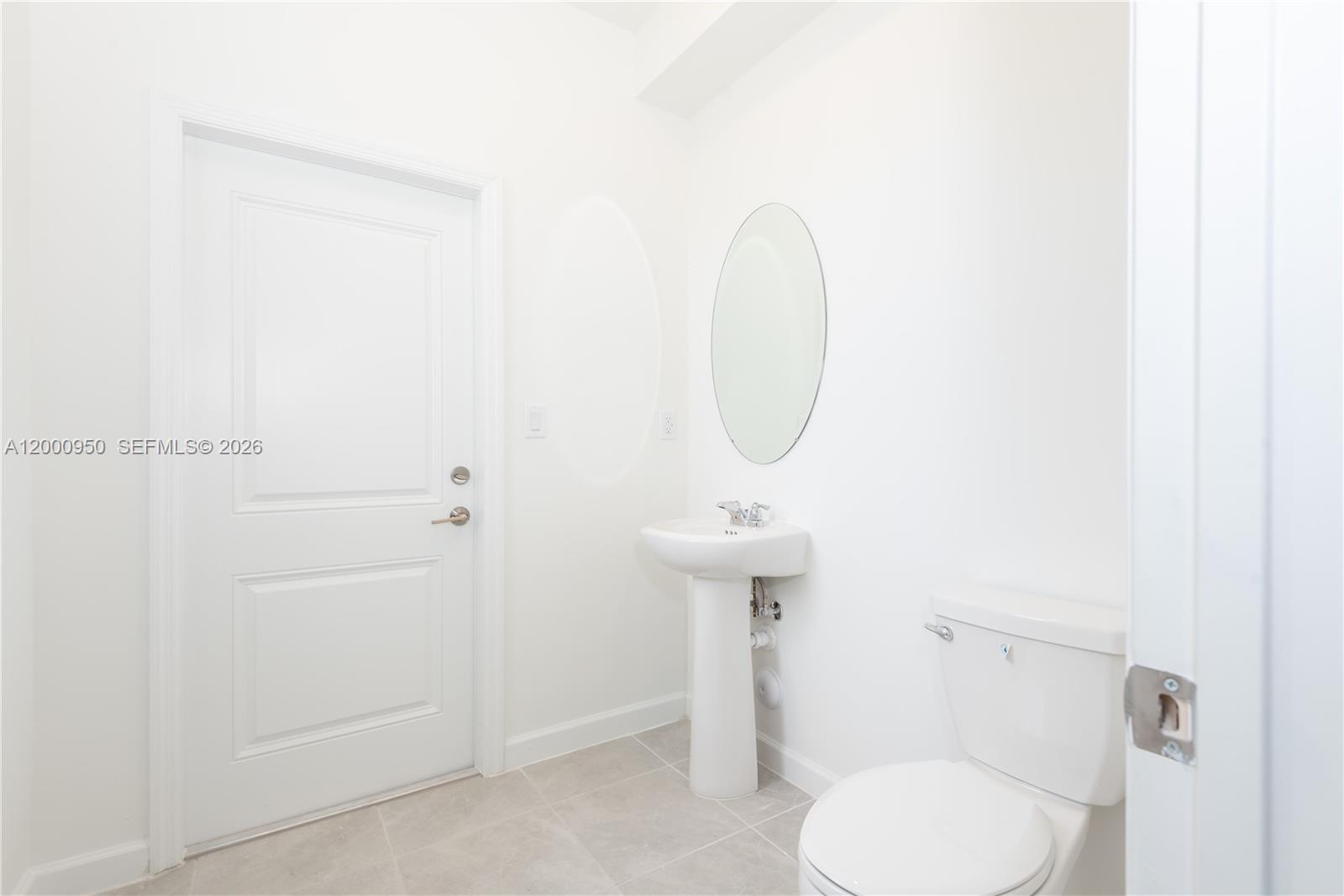 2636 Southeast 8th Court Homestead, FL 33035 - Photo 10 of 34 a bathroom with a toilet