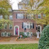 a view of a brick building next to a yard
