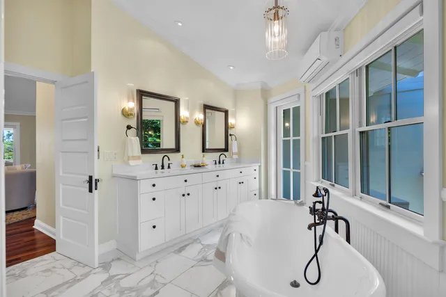 a bathroom with a bathtub and a shower