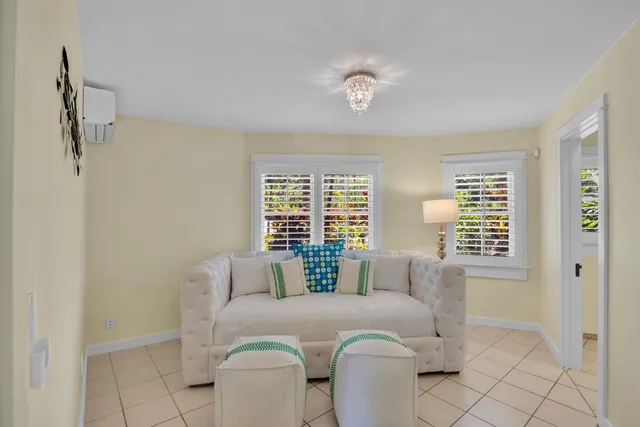 a bathroom with a toilet sink vanity and mirror