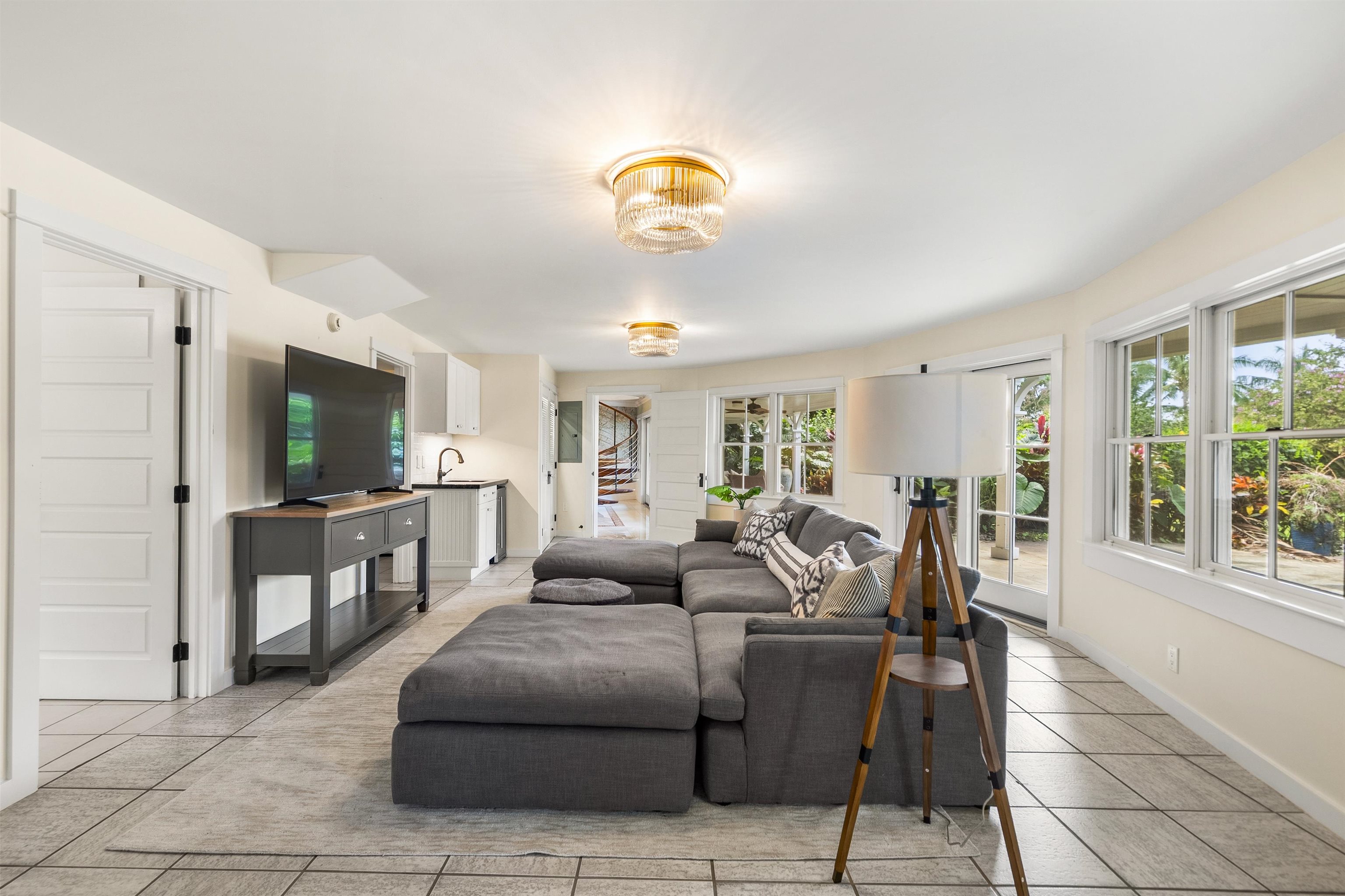 65 North Holokai Road Haiku, HI 96708 - Photo 30 of 50 a living room with furniture a flat screen tv and a window