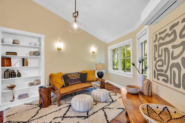 a kitchen with stainless steel appliances a dining table chairs and granite counter tops