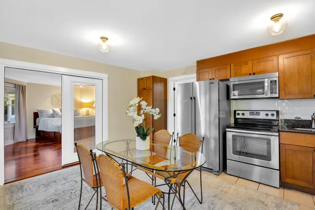 a bedroom with furniture and a flat screen tv
