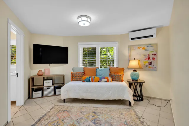 a bathroom with a granite countertop toilet sink and mirror