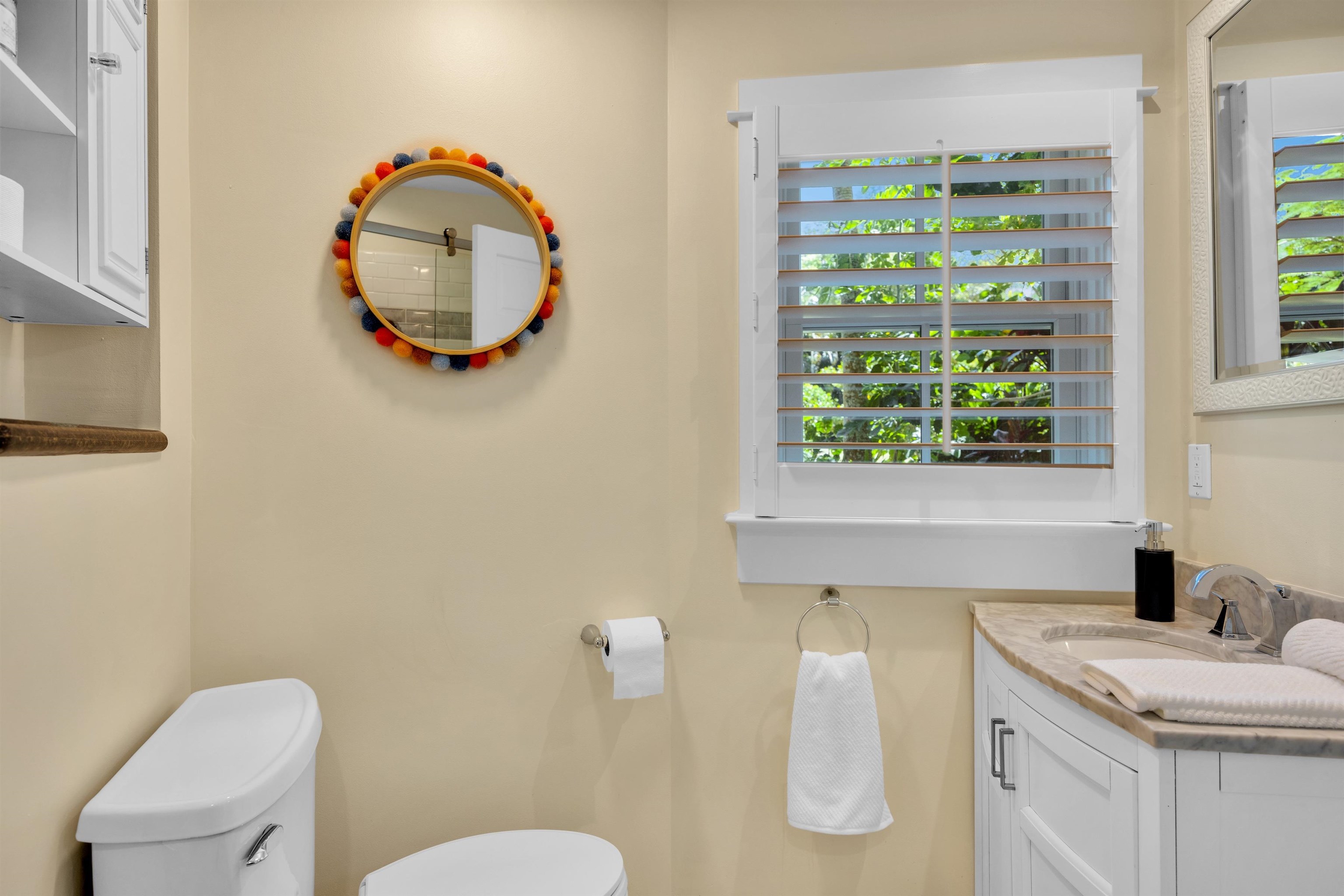 65 North Holokai Road Haiku, HI 96708 - Photo 38 of 50 a bathroom with a granite countertop toilet sink and mirror