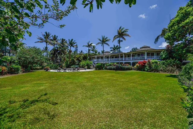 an aerial view of residential house with outdoor space and swimming pool