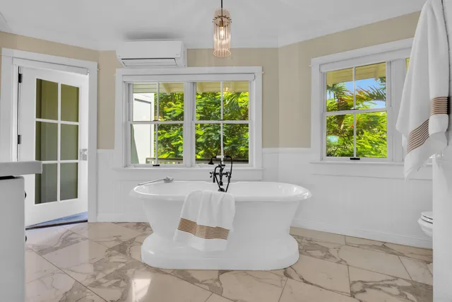 a bathroom with a bathtub and sink