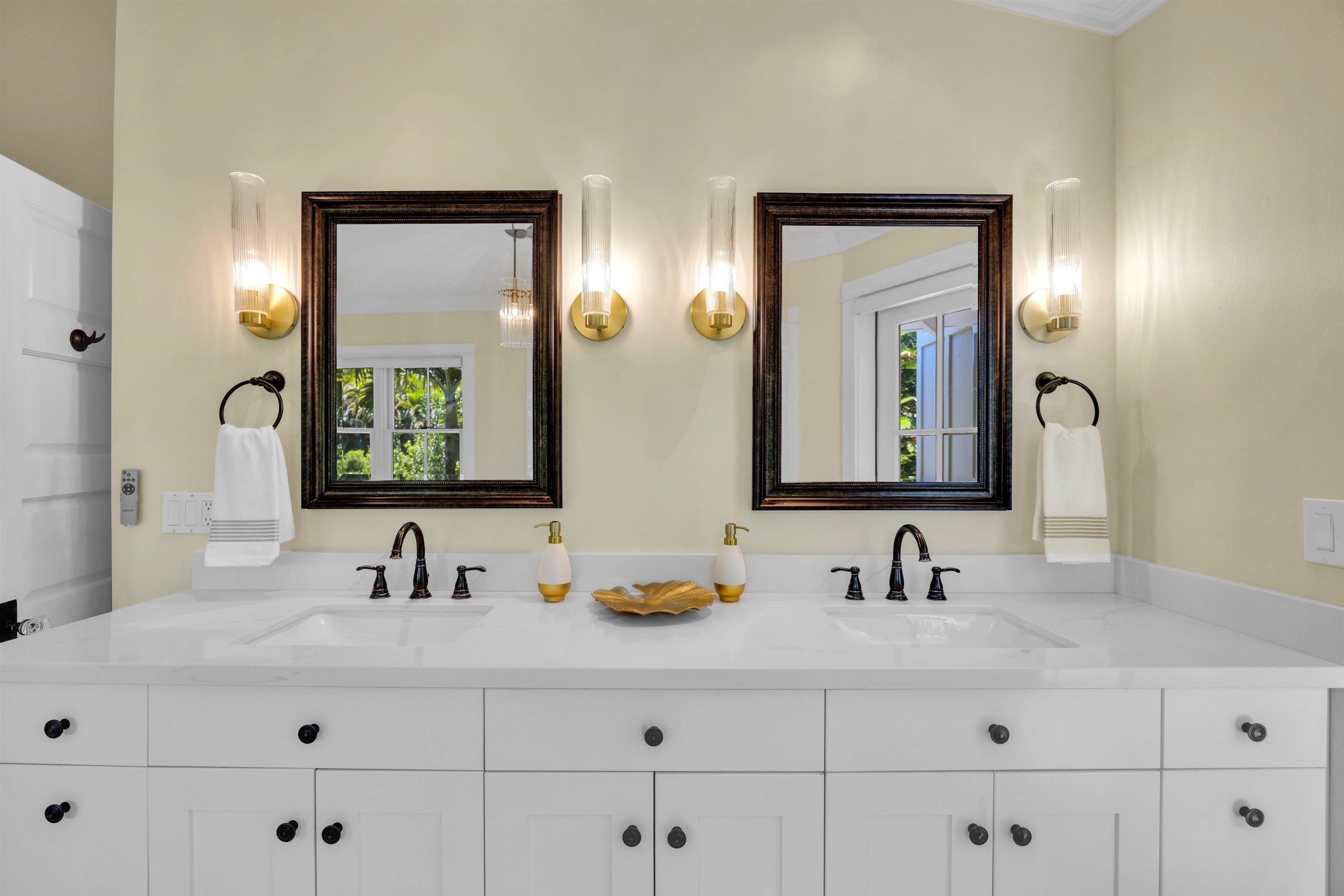 65 North Holokai Road Haiku, HI 96708 - Photo 9 of 50 a bathroom with double vanity sinks and a mirror