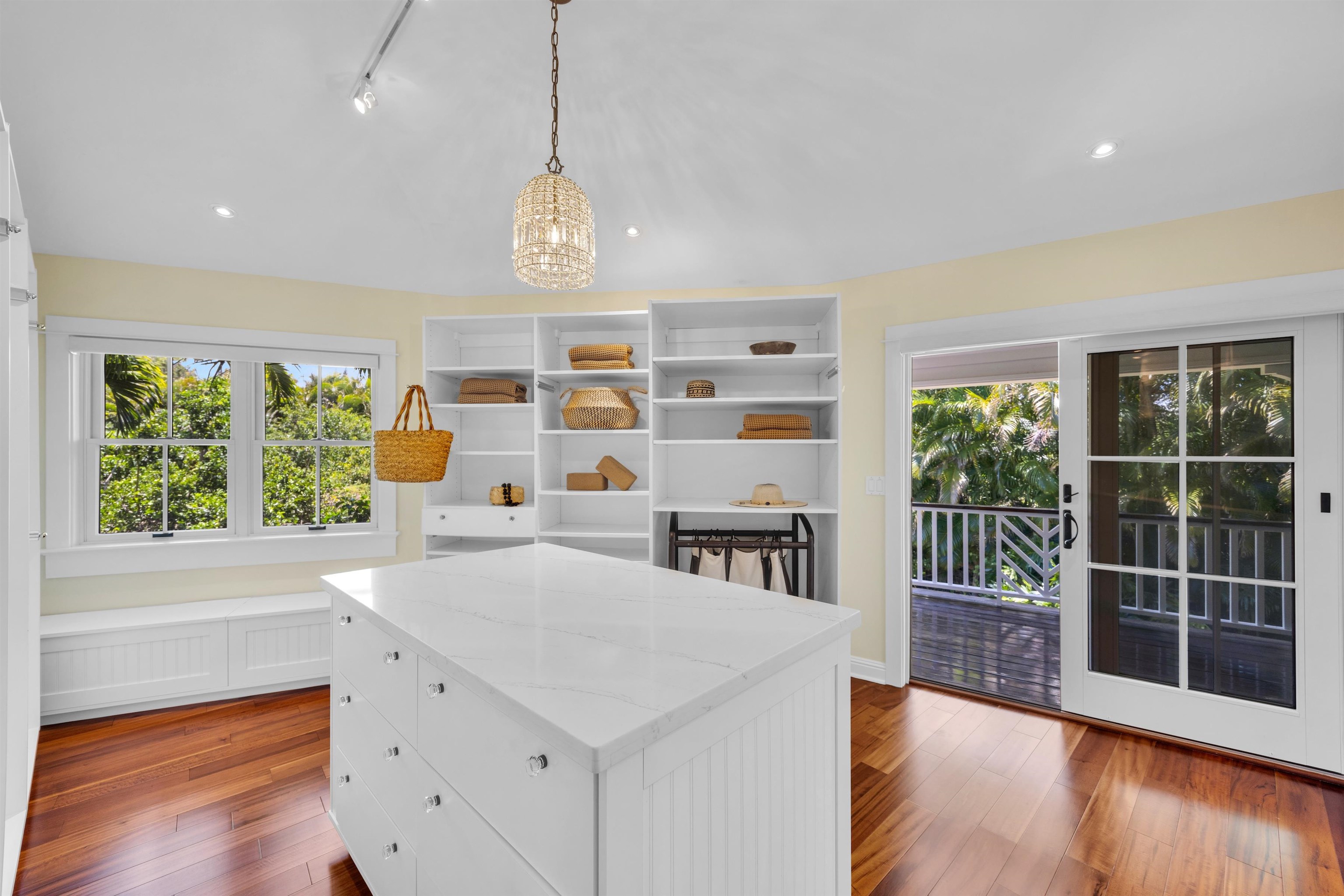 65 North Holokai Road Haiku, HI 96708 - Photo 10 of 50 a view of a kitchen with furniture and wooden floor