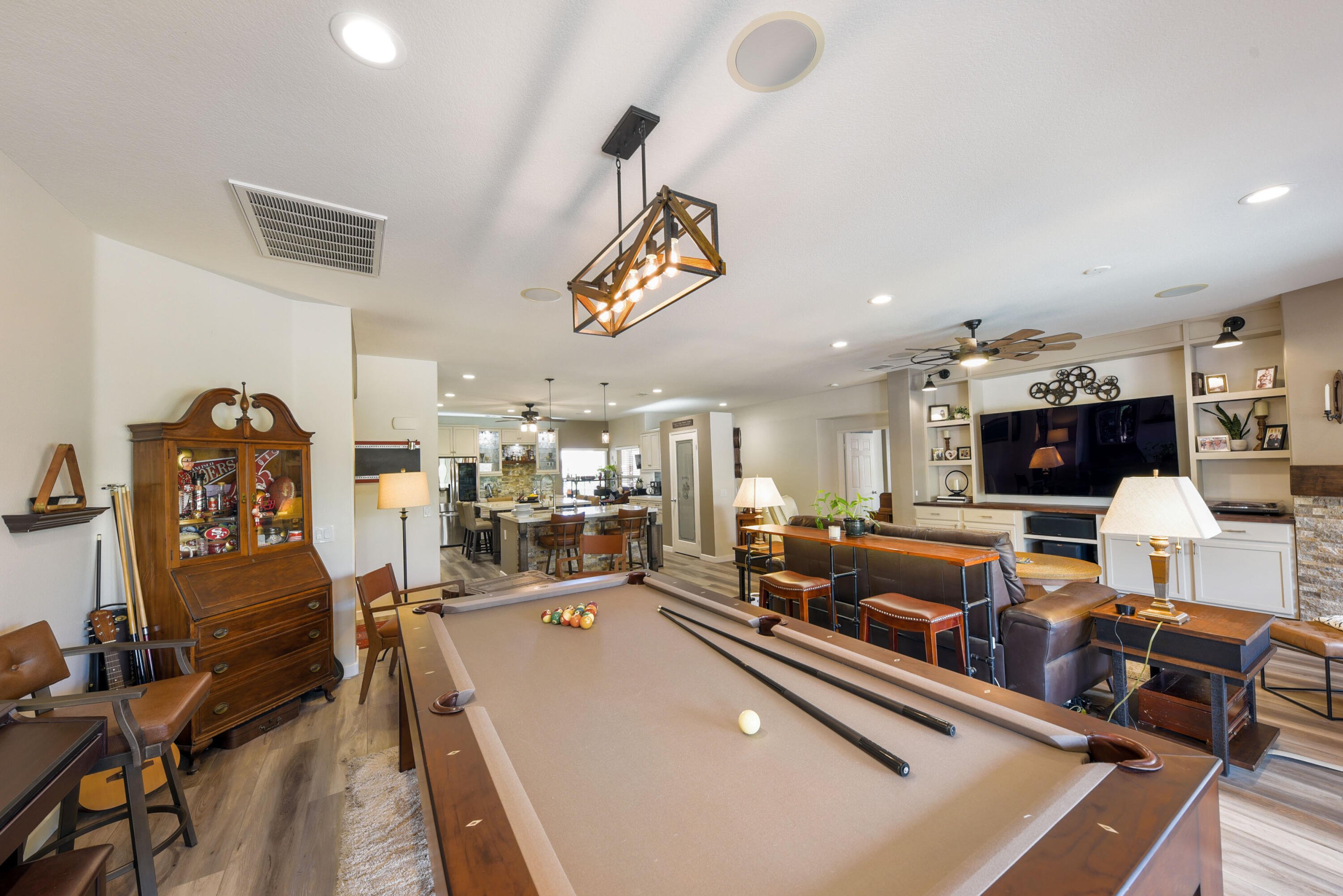 83164 Prairie Dunes Way Indio, CA 92203 - Photo 14 of 60 a living room with lots of furniture and a chandelier
