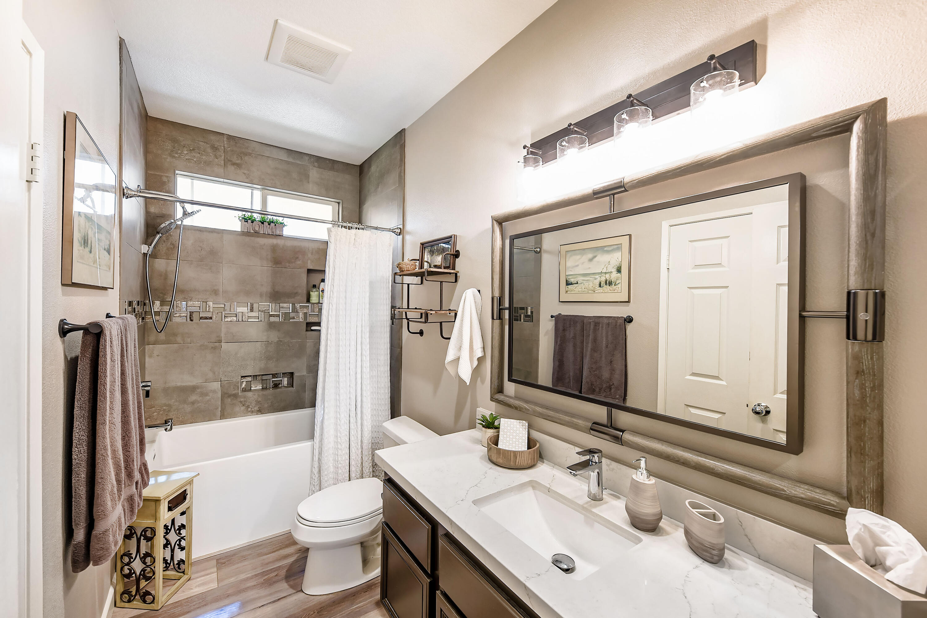 83164 Prairie Dunes Way Indio, CA 92203 - Photo 20 of 60 a bathroom with a double vanity sink toilet mirror and shower