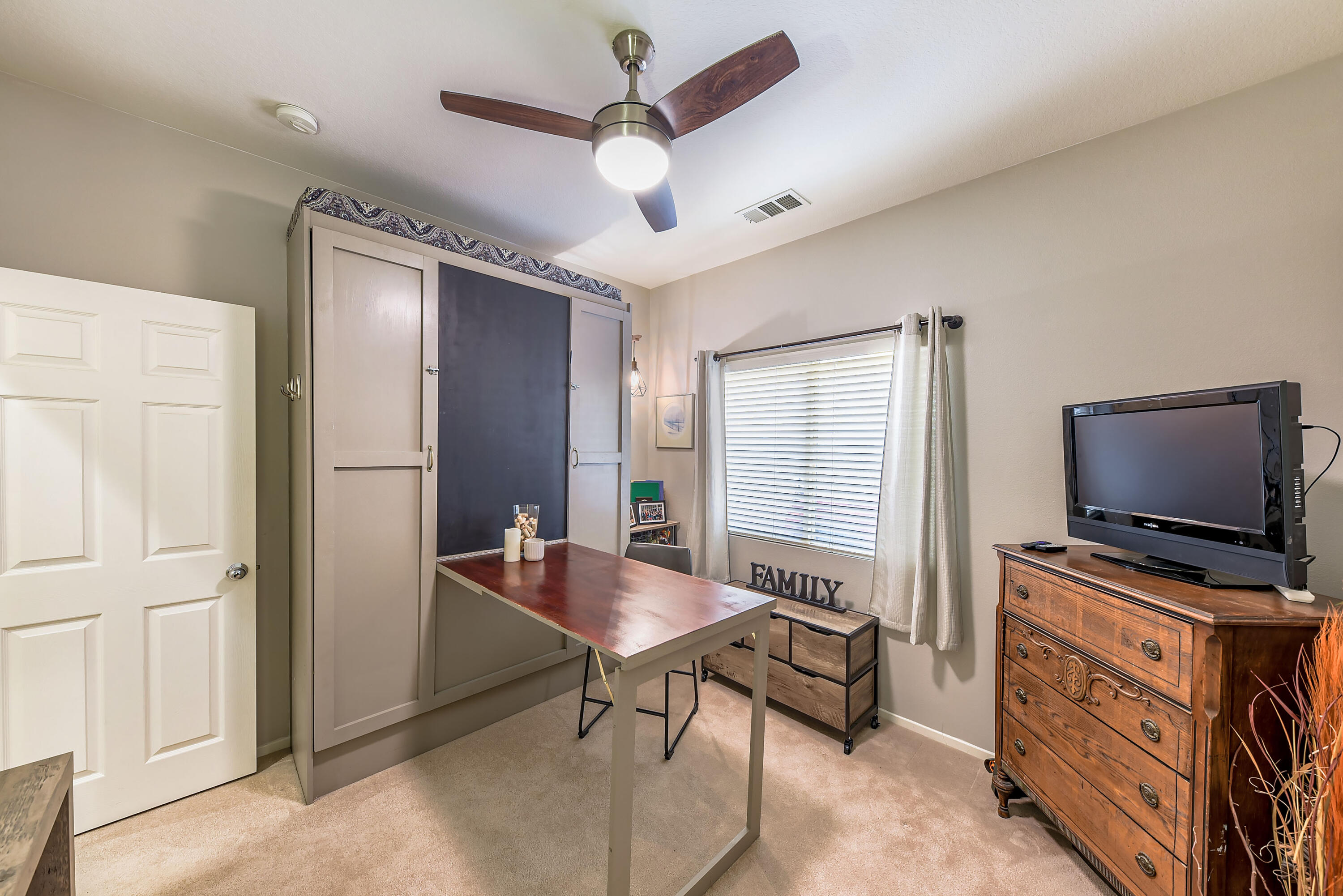 83164 Prairie Dunes Way Indio, CA 92203 - Photo 22 of 60 a living room with furniture and a flat screen tv