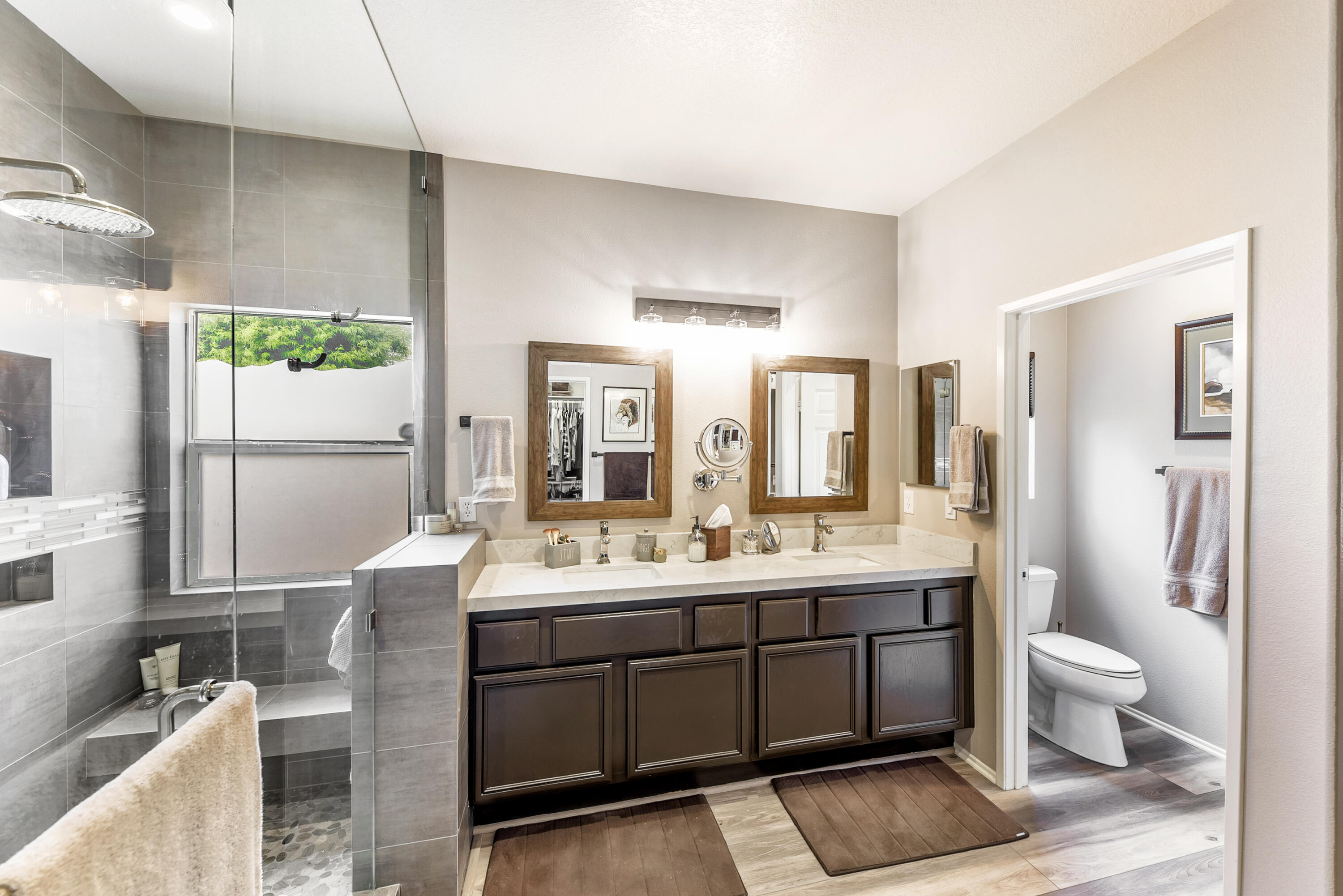 83164 Prairie Dunes Way Indio, CA 92203 - Photo 26 of 60 a en suite bathroom with a double vanity sink a mirror and a shower