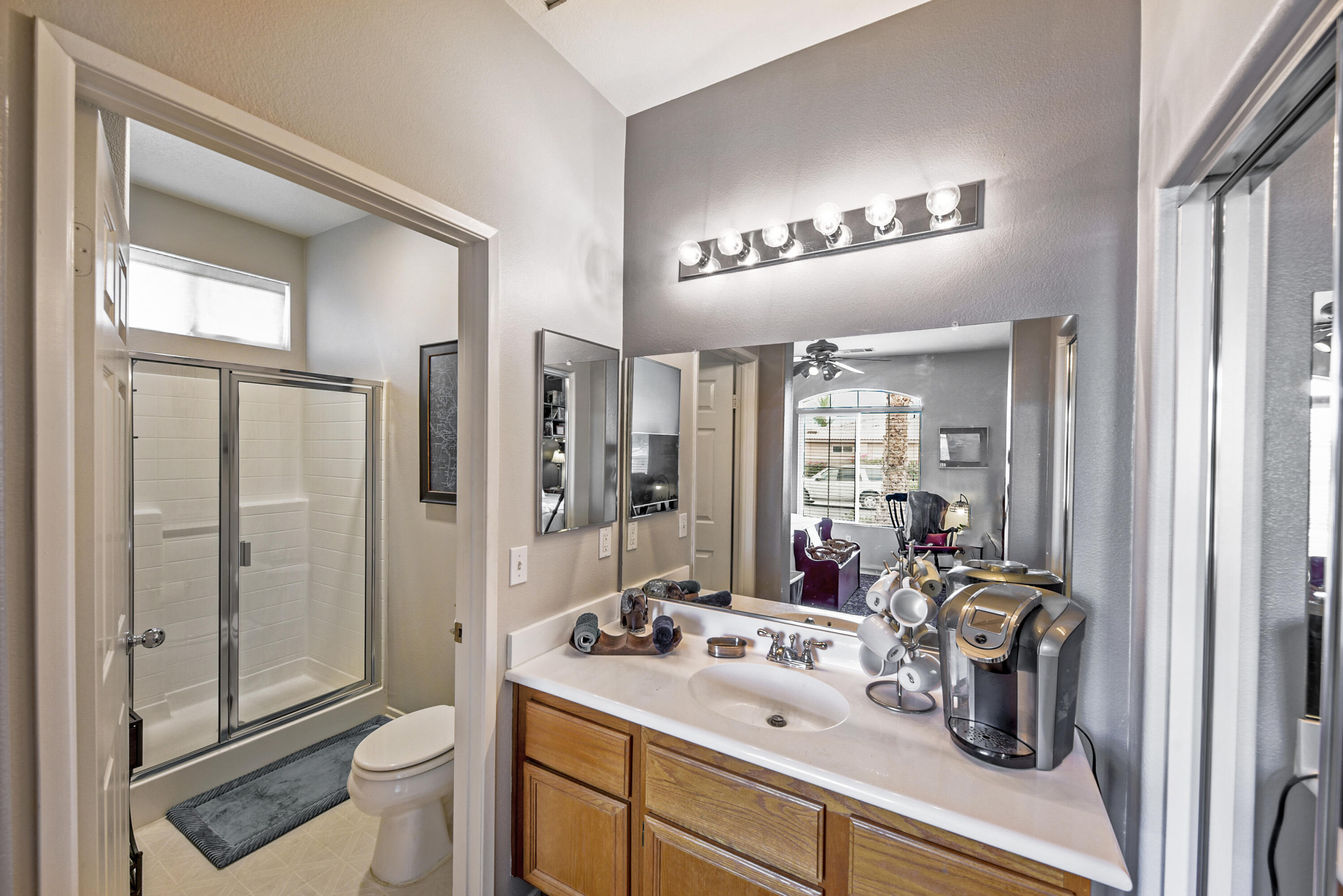 83164 Prairie Dunes Way Indio, CA 92203 - Photo 32 of 60 a bathroom with a sink a toilet and shower