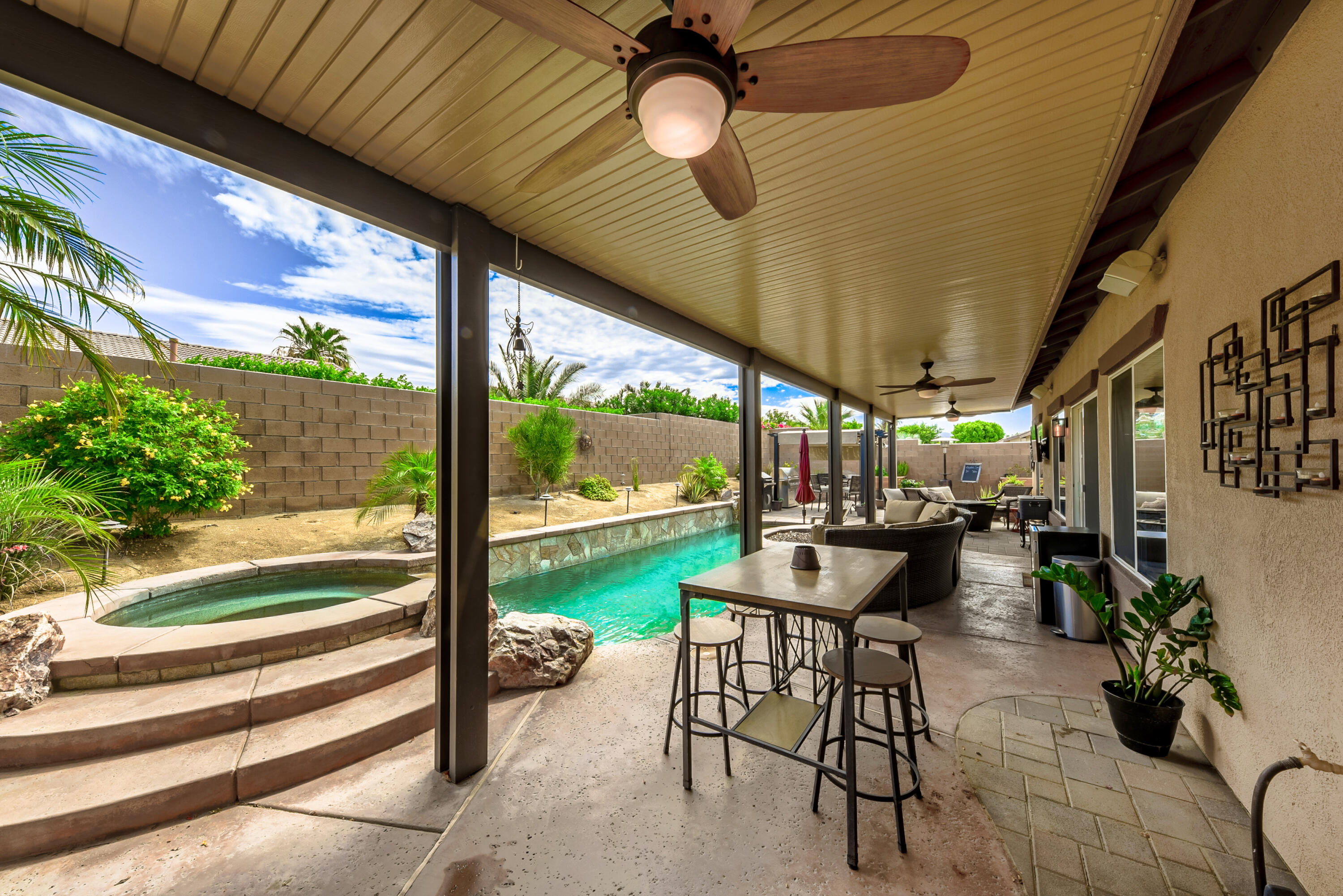 83164 Prairie Dunes Way Indio, CA 92203 - Photo 43 of 60 a very nice looking living room with a large window and a table